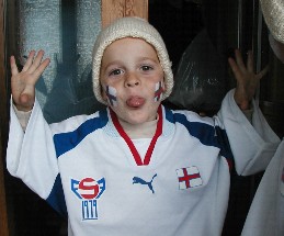 Bogi Petersen, 3 years old in 2002, in a Faroe Islands replica soccer jersey, ready for a match against Germany