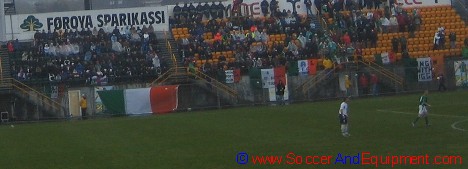 Irish supporters sitting in the rain at Tórsvøllur Stadium in Tórshavn, Faroe Islands